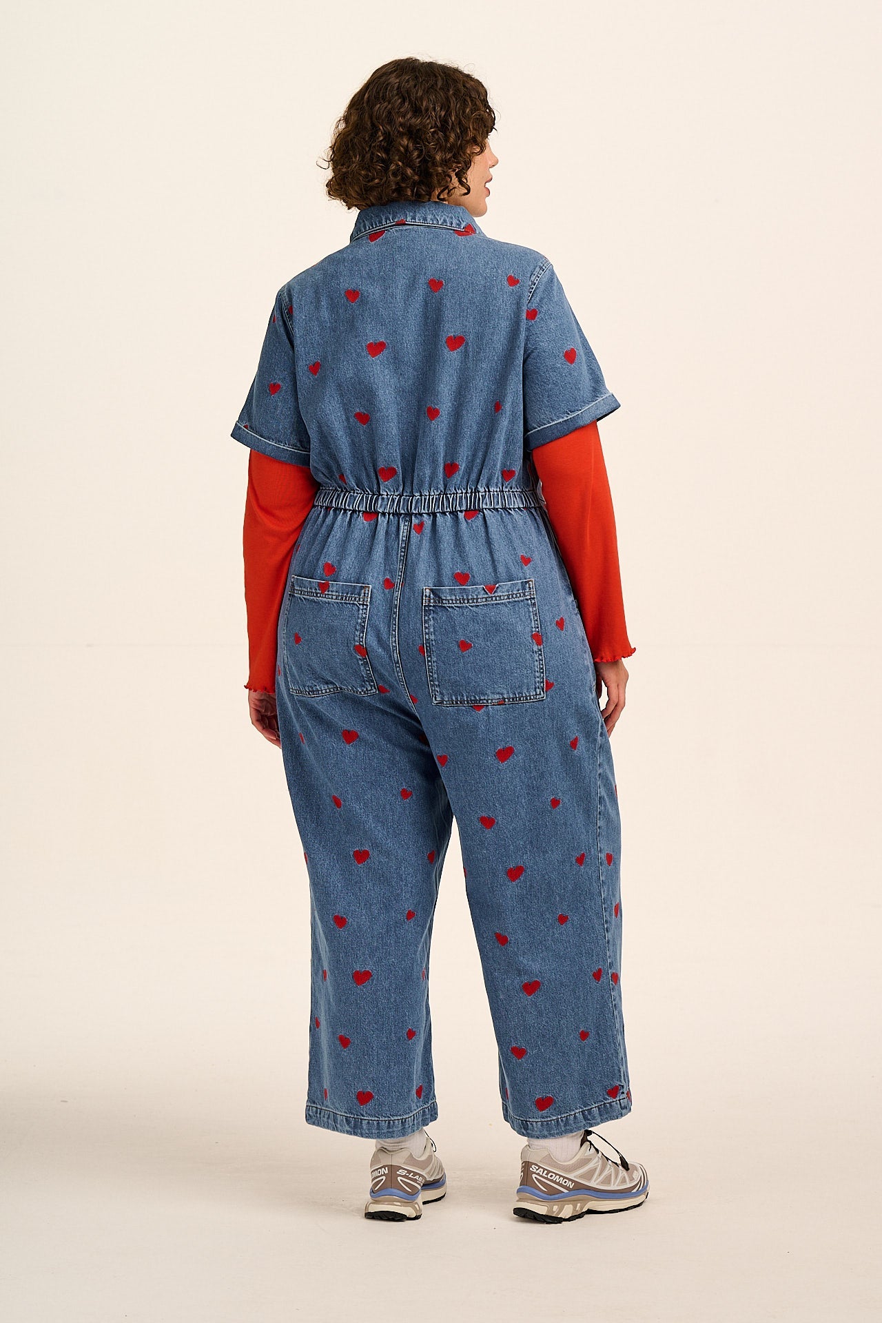 Ragan - Denim Jumpsuit in Mid Wash with Cupid Hearts