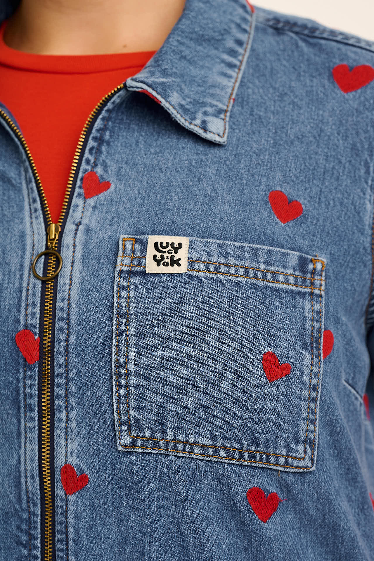 Ragan - Denim Jumpsuit in Mid Wash with Cupid Hearts